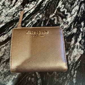 Kate spade wallet rose gold perfect condition small.